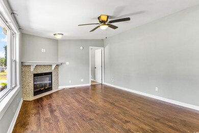 Unfurnished living room with hardwood / wood-style