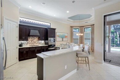 Kitchen featuring crown molding, a sink, custom ra