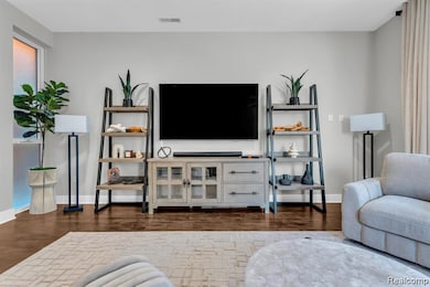 Living area featuring dark wood finished floors