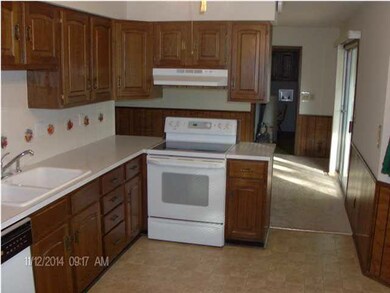 kit view to lr, laundry rm, and sun rm entry. majo