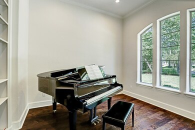 The room by the entryway is an excellent office, study, or music room.