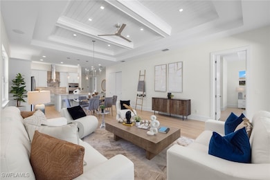 Living room with light hardwood / wood-style floor