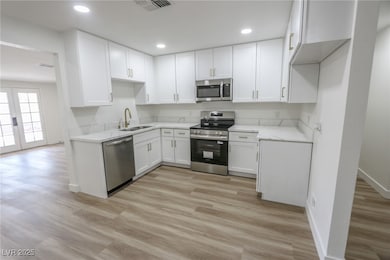 Kitchen featuring appliances with stainless steel