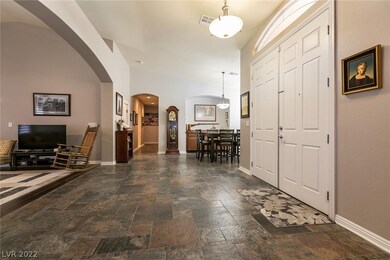 Entry on right, living room to left, formal dining