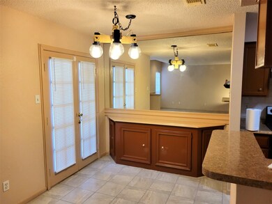 Bright dining area with elegant French doors.