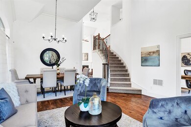 Dining. Stairs. Updated lighting. Hardwood floors.