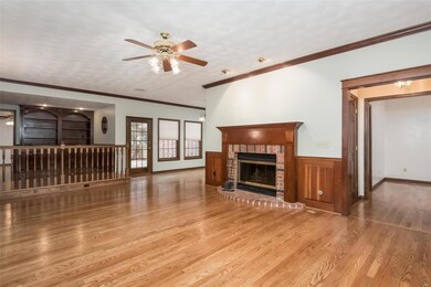 Living room with entry view and elevated office