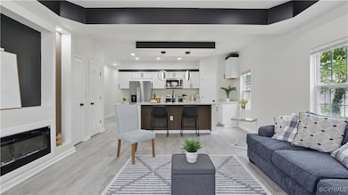 Living area featuring light wood finished floors,