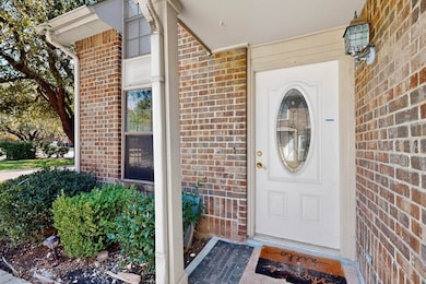 Doorway to property with brick siding