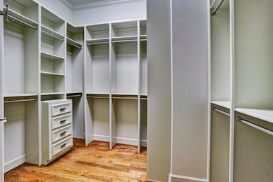 CLOSET - spacious and convenient and updated with hardwood flooring.