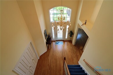 The second-floor balcony overlooks a two-story, we