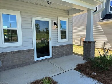 Large front porch and a storm door is standard too!