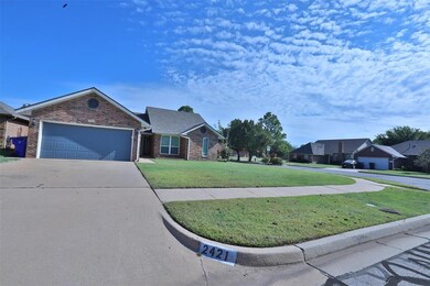 View of front of property featuring a garage and a