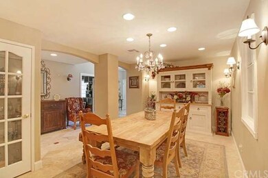 Elegant dining room w/custom chandelier and built 