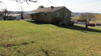 Rear of Home, View of the Farm in the Background.