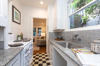 Cottage kitchen has a new refrigerator, vintage st