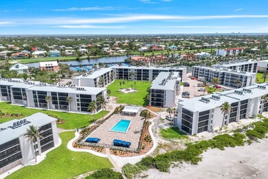 Aerial view of a nearby body of water and a pool area