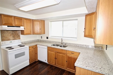 This kitchen offers granite countertops, lots of c