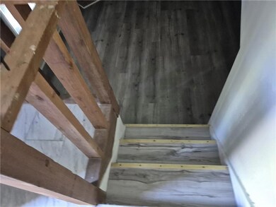 View of stairway leads to Family Room, Laundry Rm and Garage Inside Door.