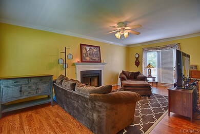 Roomy family room with hardwood floors, crown moul
