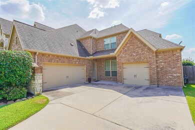 The long driveway compliments the 3 car attached garage.