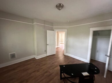 Interior space featuring dark hardwood / wood-style flooring and a closet