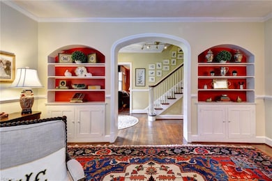Built-in bookcases with arched doorway