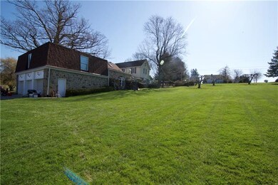 Another view, including the attached 3 stall garag