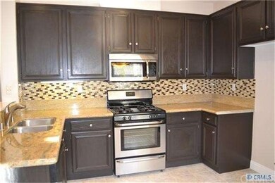 Updated kitchen with restained cabinets, new grani