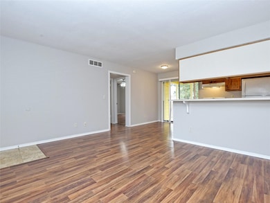 Unfurnished living room with wood finished floors