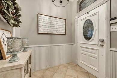 Warm entrance with designer paints, wainscoting an