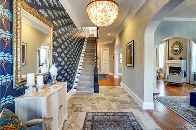Welcoming foyer leading past front parlor, second parlor, dining room and into kitchen/family room.