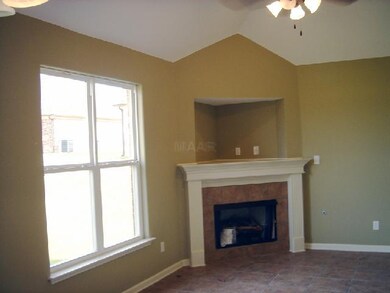 Gas log fireplace in Hearth Room
