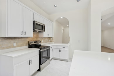 Kitchen with electric range