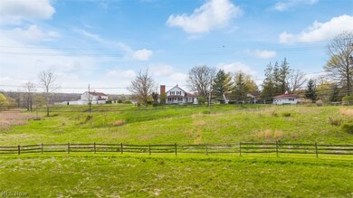 View of yard with a rural view