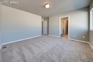 Unfurnished bedroom featuring connected bathroom a