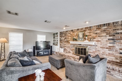 The living room lets in plenty of natural light wi
