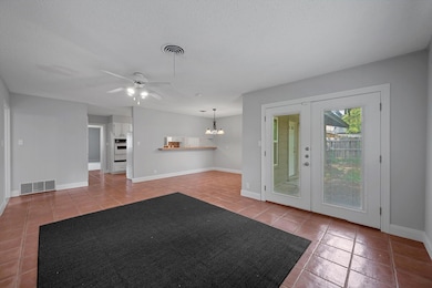 Unfurnished living room with tile patterned floor