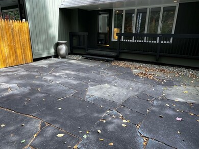Just off the living room, your private stone patio