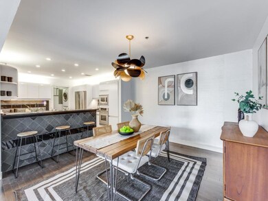 Dining area with dark wood-type flooring, ceiling