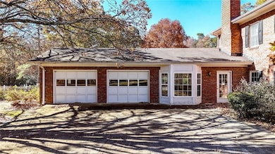 Garage featuring driveway