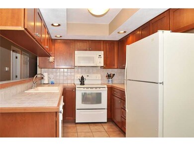 Kitchen. New Cherry Cabinets, Tile Backsplash, Young Appliances, Tile Floors!