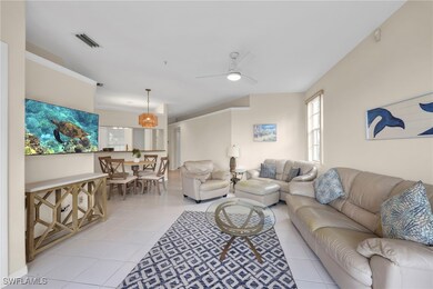 Living room with light tile patterned floors and a