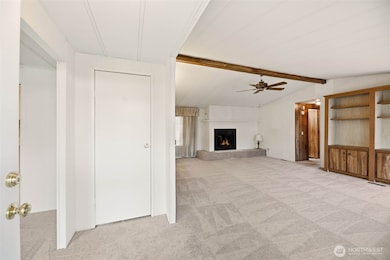As you enter the home, there is a coat closet right off entrance and the family room to the right. To the left leads to the dining room and primary bedroom. This beautiful new carpet runs throughout the home.