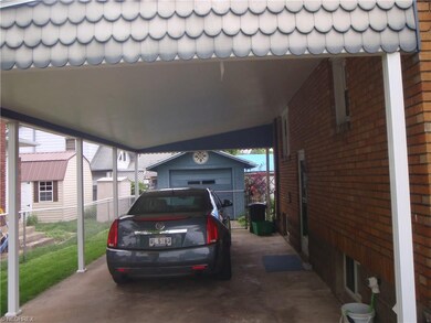 Spacious carport garage beyond