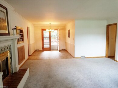 The dining room has lovely French doors leading to