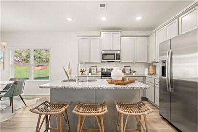 Kitchen with stainless steel appliances, sink, an 