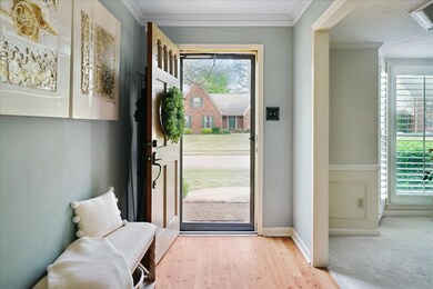 Entrance foyer with baseboards, a textured ceiling