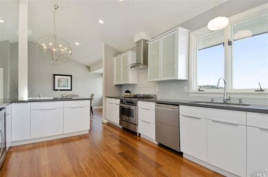 Kitchen with Bertazzoni Range and wine refrigerato