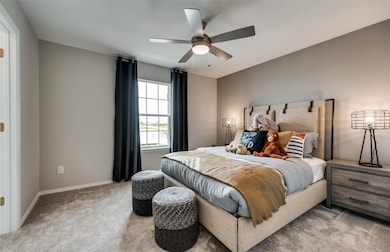 Roomy secondary bedroom with extensive closet storage *Model representation
